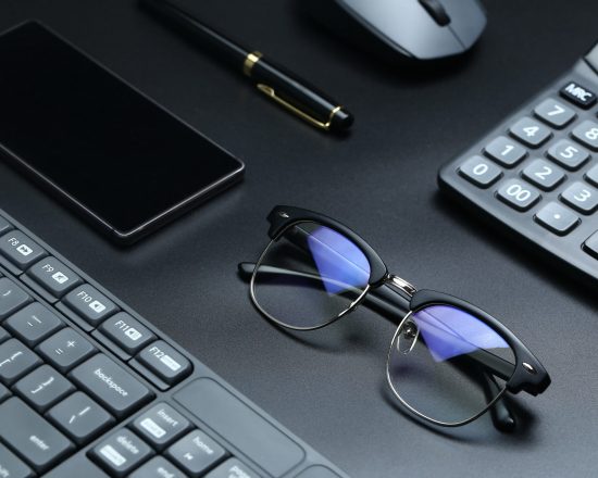 black office business equipment on black background